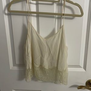 Aritzia cream sheer tank top with lace detail at bottom size medium